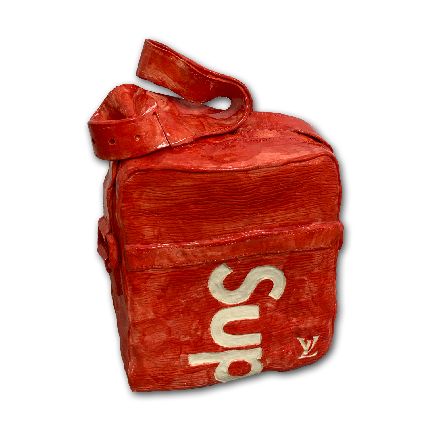 A bright red ceramic shoulder bag with a curved handle, featuring white lettering and a designer logo on its front face. The textured glazed surface mimics the appearance of worn leather or fabric with visible brushstrokes and dimensional relief throughout.