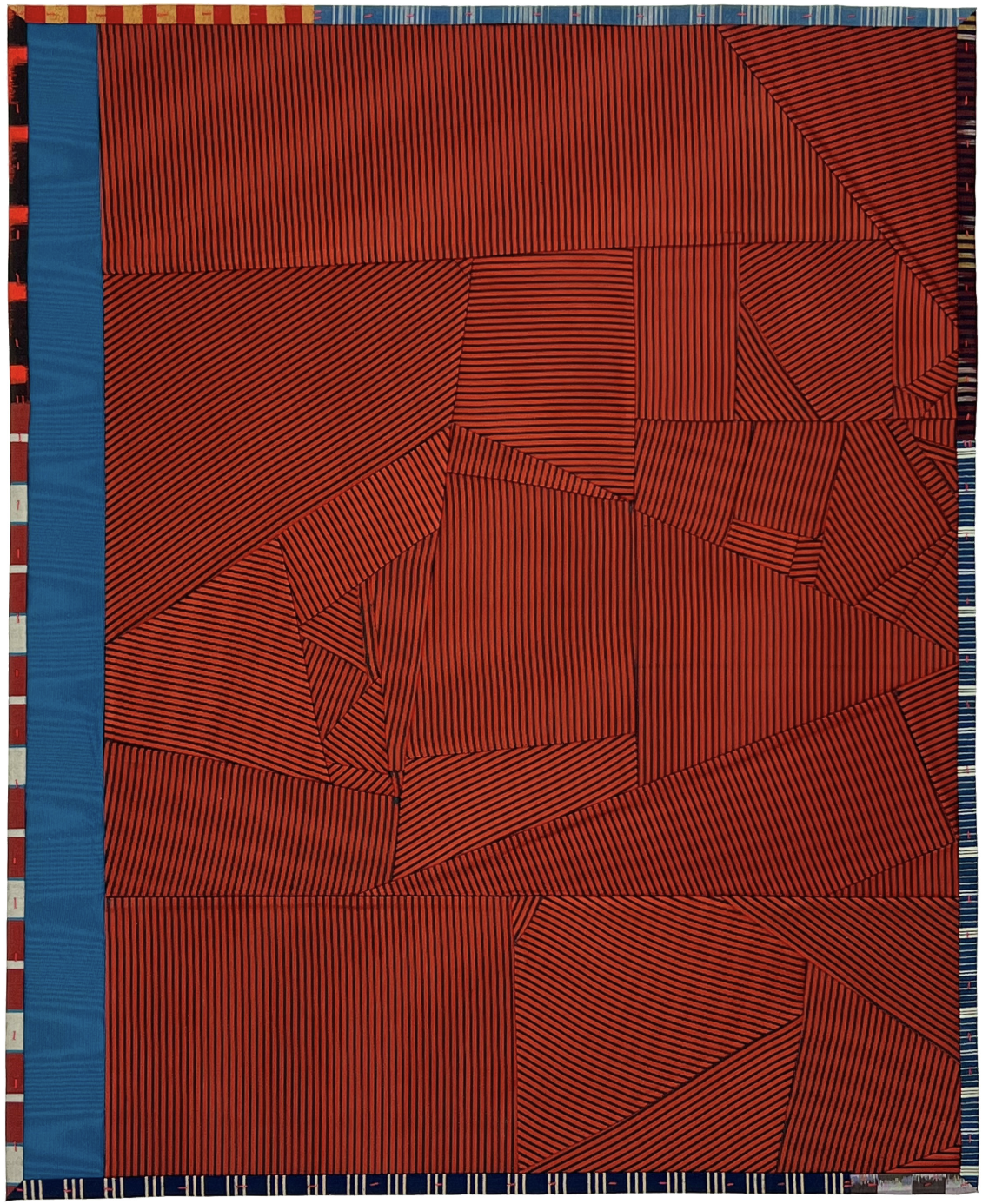 A vibrant textile composition dominated by deep red and black horizontal striped patterns arranged in geometric blocks of varying angles and directions, creating a dynamic three-dimensional effect. A solid blue vertical band frames the left edge, with decorative striped borders in blue and neutral tones along the top and bottom.