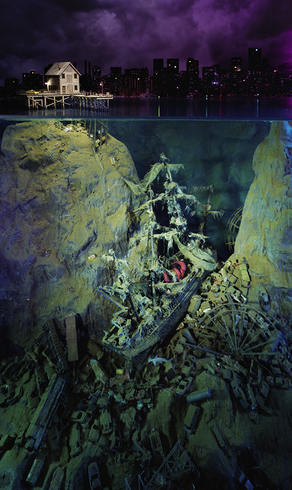 A split-composition artwork showing a deteriorated shipwreck submerged in murky yellow-green water below, contrasted with a glowing white house on stilts overlooking a dark cityscape above the waterline, set against a dramatic purple-toned sky.