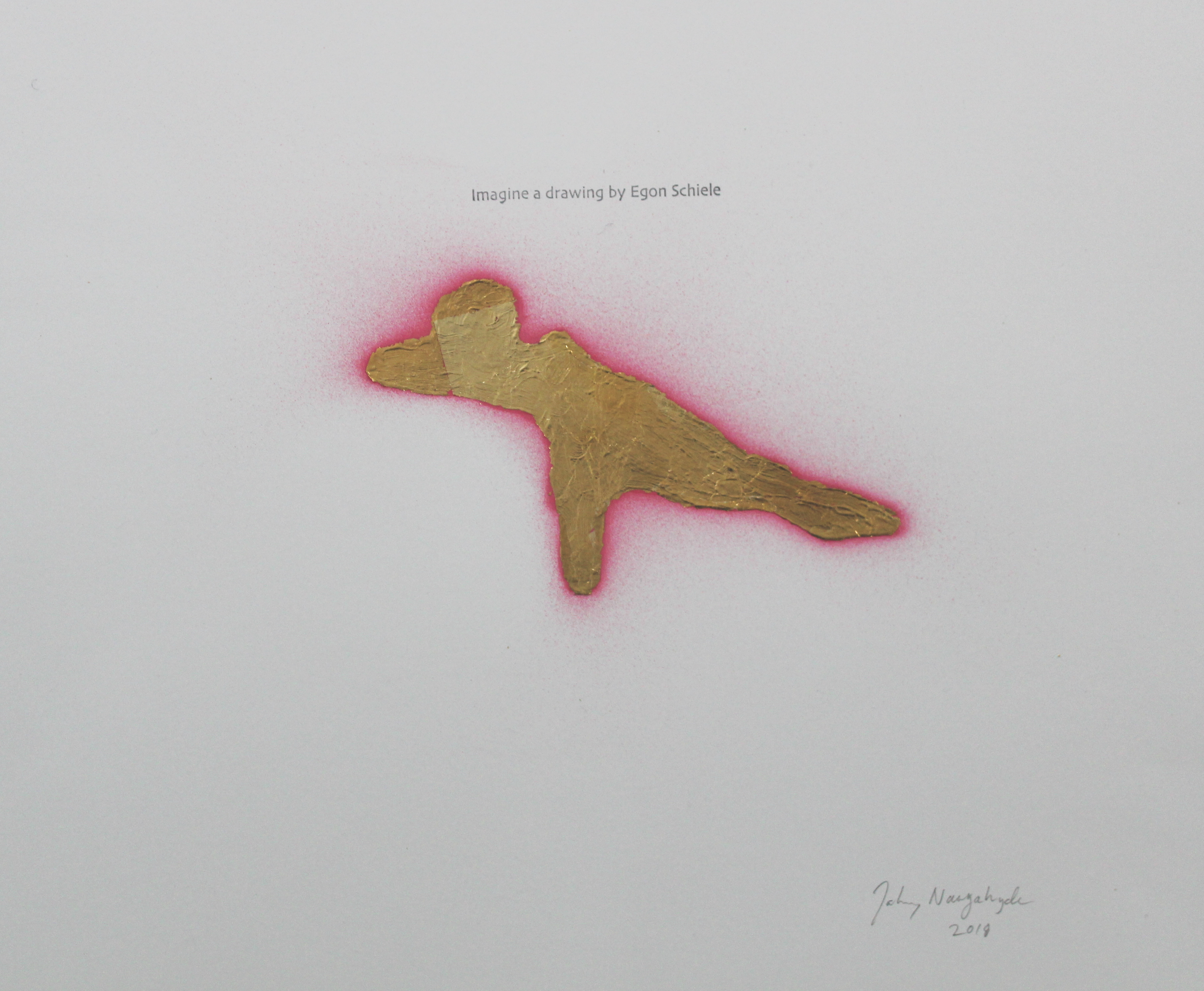 A gold leaf figure in a contorted, horizontal pose with outstretched limbs is surrounded by a vibrant pink halo that radiates across white paper, creating a luminous effect around the metallic form.