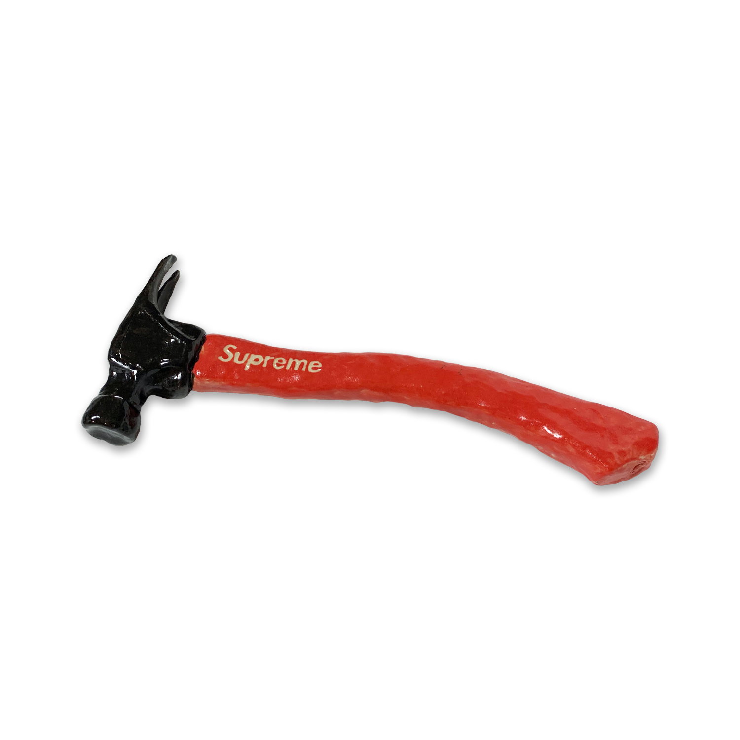 A ceramic hammer with a black glazed head and a red handle featuring white text, photographed against a white background.