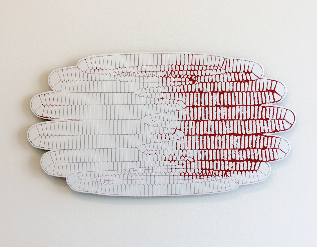 Stacked sculptural forms resembling elongated leaves or feathers rendered in white porcelain-enameled steel with linear red markings concentrated toward the center, creating a sense of depth and movement against a neutral background.