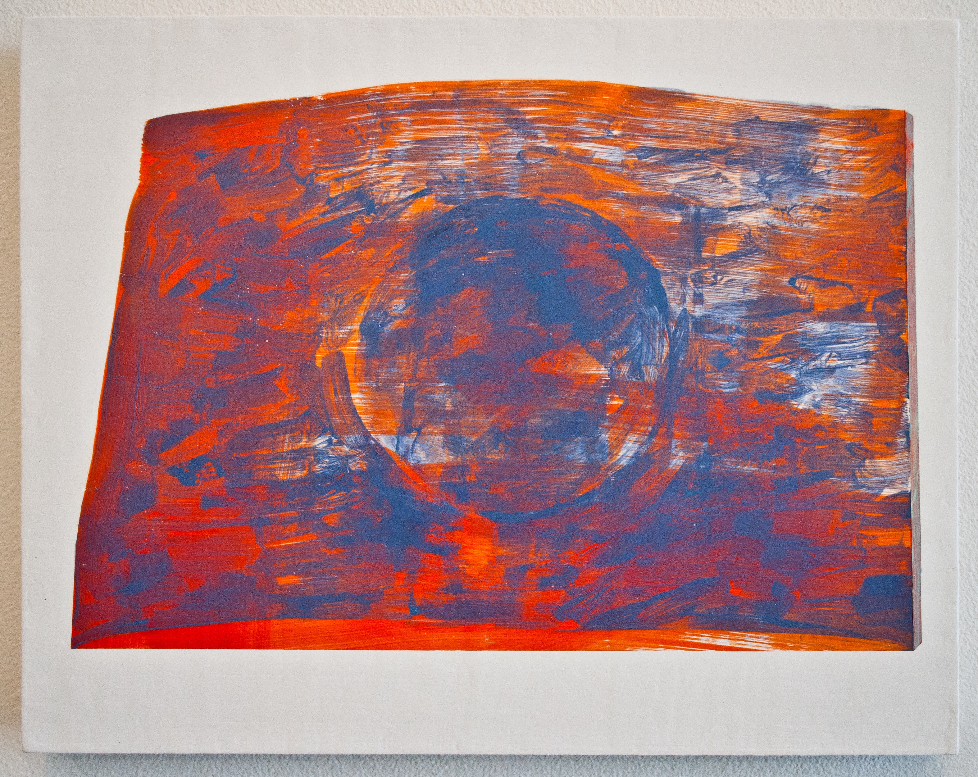 Abstract painting on curved wooden panel featuring bold gestural brushstrokes in deep blue, vibrant orange, and red tones. A circular form dominates the center, surrounded by dynamic, sweeping marks that create a sense of movement and energy across the composition.
