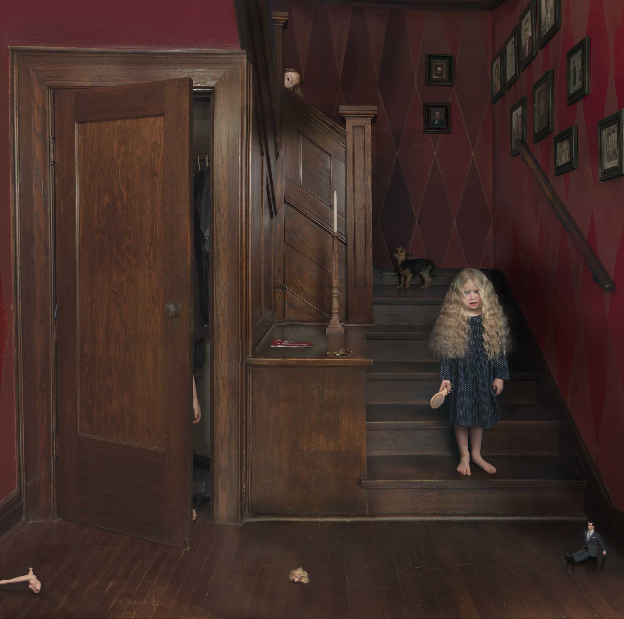 A young girl with long, curly blonde hair stands barefoot on a wooden staircase in a burgundy-walled interior, wearing a dark patterned dress. Surrounding the scene are wooden doors, framed artworks on the walls, a small dog on the stairs, and miniature figures positioned at various points throughout the composition, creating a surreal domestic tableau.