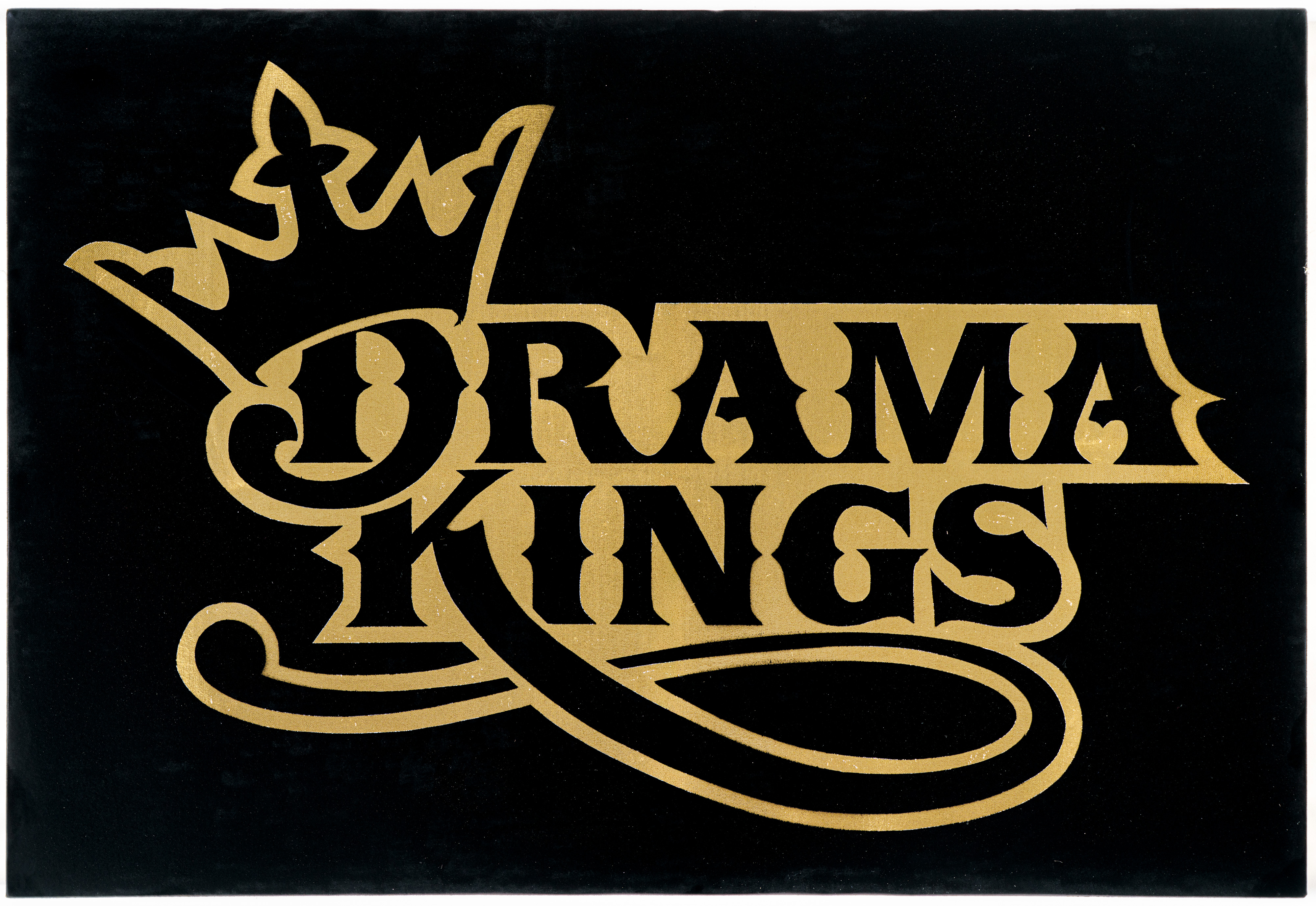 Gold ornamental lettering arranged in a decorative crown-topped composition against a solid black background, featuring elaborate flourishes and serif details in a classical theatrical style.