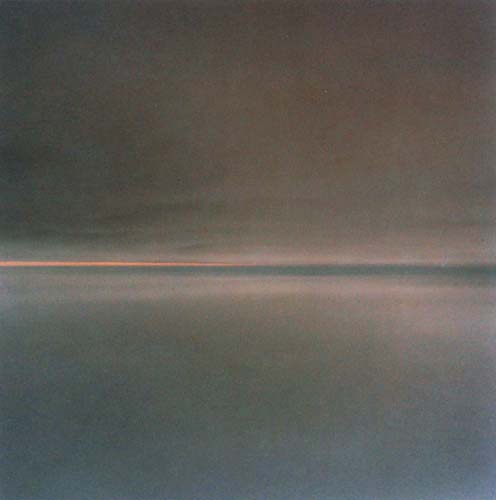 A minimalist landscape divided horizontally into two sections: a dark gray-brown upper half representing sky and a lighter blue-gray lower half representing water or land, separated by a thin band of warm peachy-orange light across the middle.