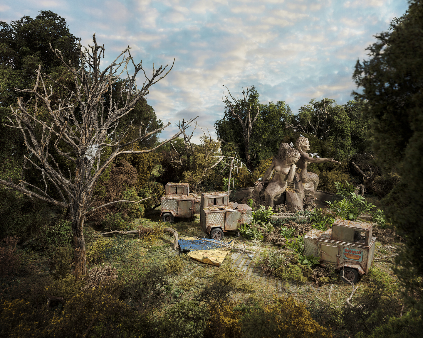 An overgrown abandoned amusement park scene features weathered carnival ride cars and vendor carts reclaimed by dense vegetation and moss-covered trees. A classical stone statue of a cherub or putto figure stands prominently among the decaying structures, creating a surreal landscape where nature and human-made attractions exist in decay.