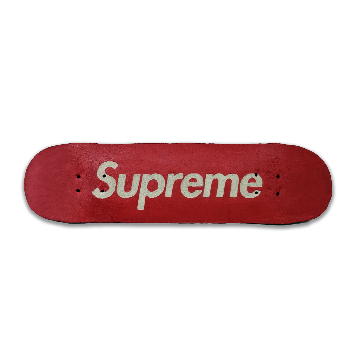 A red ceramic skateboard deck with white lettering reading "Supreme" centered on the grip tape surface, featuring two small circular holes on either side of the text.