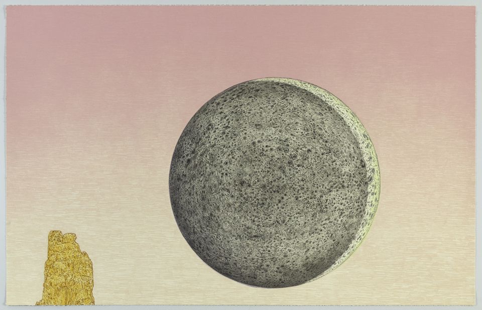 A gray textured sphere dominates the right side of the composition against a gradient sky transitioning from dusty pink to pale yellow. A small gold-colored rocky form appears in the lower left corner, creating scale contrast with the large celestial body.