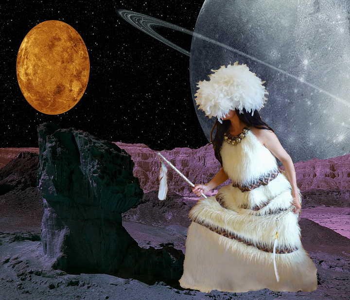 A figure wearing an elaborate white feathered headdress and matching fringed garment sits on a purple-hued alien landscape, gazing toward a glowing orange celestial body. A massive ringed planet looms in the starry sky above rocky terrain dotted with dark stone formations.