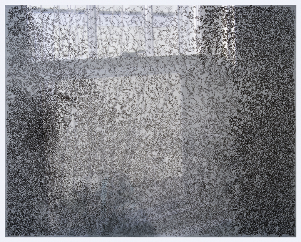 Densely layered abstract composition featuring intricate linear patterns and organic marks in grayscale, transitioning from lighter tones in the center to darker areas at the edges, creating a contemplative, textured surface with varying depths and visual complexity.