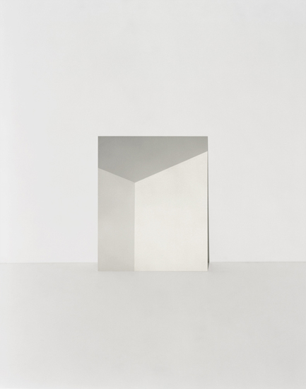 Minimalist composition featuring an open white envelope or folded paper form against a soft beige background, with a gray geometric plane visible at the top edge, creating a subtle study in negative space and neutral tones.