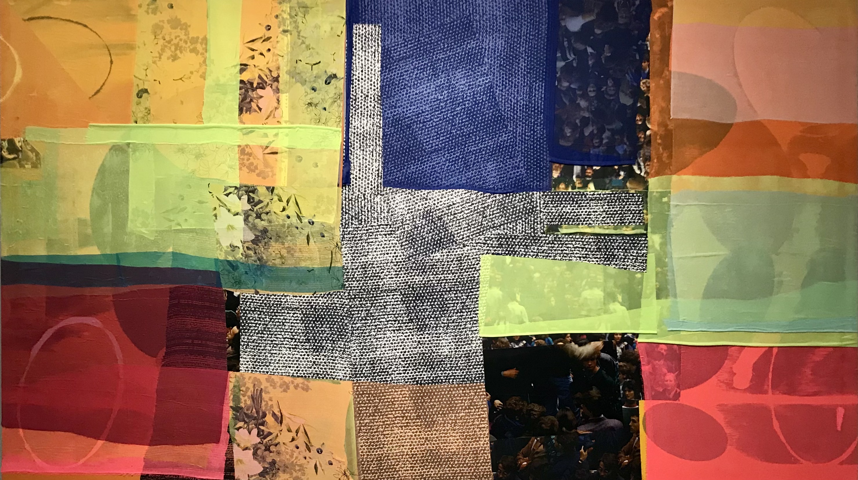 A vibrant abstract collage composed of layered geometric shapes in shades of orange, yellow, green, blue, red, and neutral tones. The composition combines translucent colored panels with textured fabric elements and areas of digital imagery, creating a dynamic interplay of opacity and transparency across the surface.
