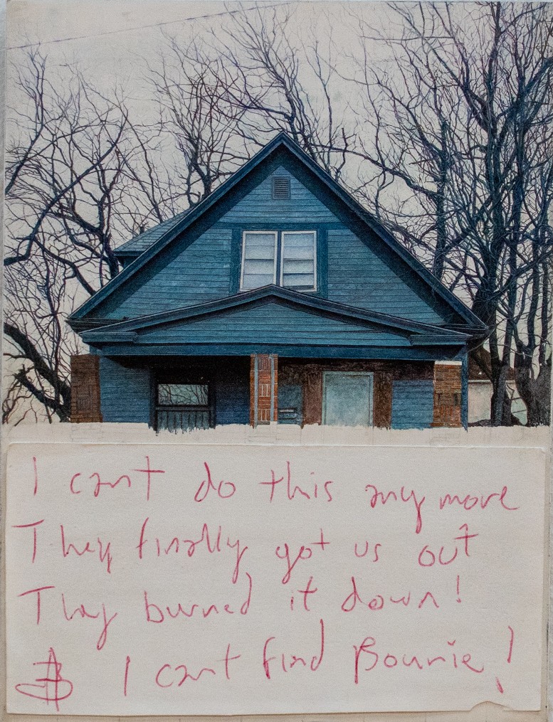 A blue house with bare trees stands in winter snow, its windows and brick foundation visible. Handwritten text in red ink covers the lower portion, expressing distress about a fire and a missing person named Bonnie.