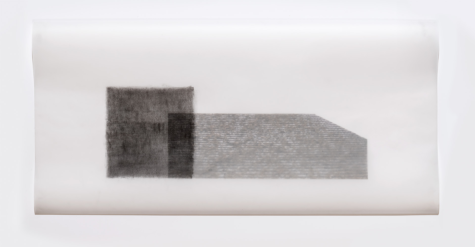 Two rectangular forms rendered in graphite on translucent vellum, positioned horizontally against a light background. The left form appears darker and more densely textured, while the right extends further with a lighter, linear pattern suggesting architectural detail or surface texture.