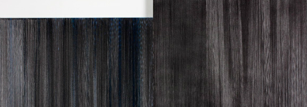 Vertical wooden planks in varying shades of dark gray and charcoal, arranged in parallel lines with subtle tonal gradations creating a minimalist, abstract composition.