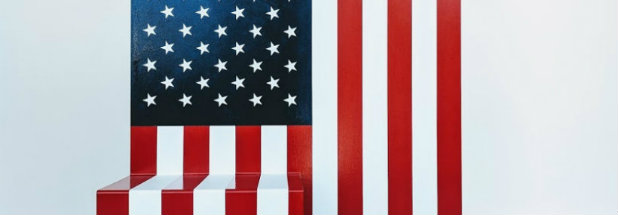 Abstracted American flag composed of stacked red and white rectangular forms beneath a traditional star-and-stripe canton, rendered in a minimalist style that deconstructs the iconic symbol into geometric, building-block-like shapes against a light background.